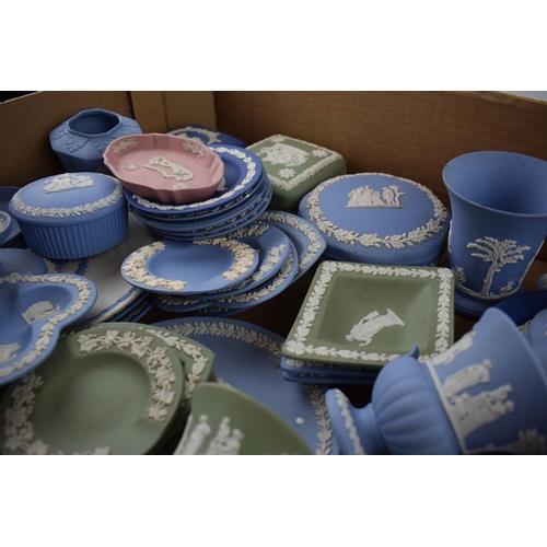 158 - A collection of Wedgwood Jasperware pieces to include vases, lidded pots, trinket trays, dishes, pin... 