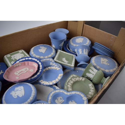 158 - A collection of Wedgwood Jasperware pieces to include vases, lidded pots, trinket trays, dishes, pin... 