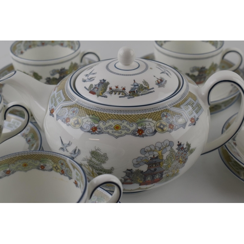 159 - Wedgwood tea ware in the Chinese Legend design to include a teapot, a milk jug, 7 trios with a spare... 