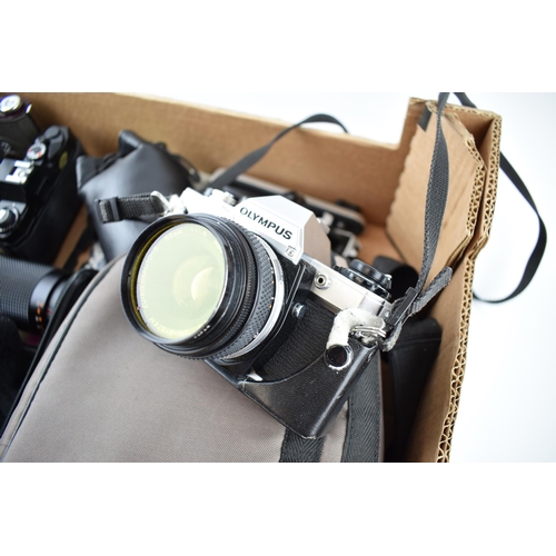 202 - A collection of vintage 35mm SLR cameras and lenses to include, Canon A-1 camera with Canon lens FD ... 