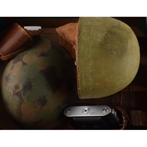 207 - A mixed collection of items to include military helmet, vintage motorcycle helmet, camera and binocu... 