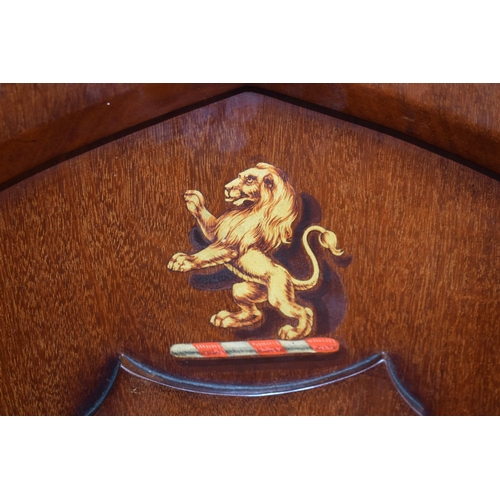 217 - A pair of antique mahogany hall chairs with lion emblem and shaped backs, 92cm tall (2).