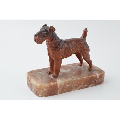 295 - French Art Deco painted metal paperweight in the form of a terrier, 12cm long.