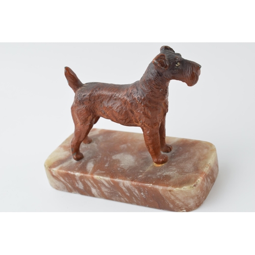 295 - French Art Deco painted metal paperweight in the form of a terrier, 12cm long.