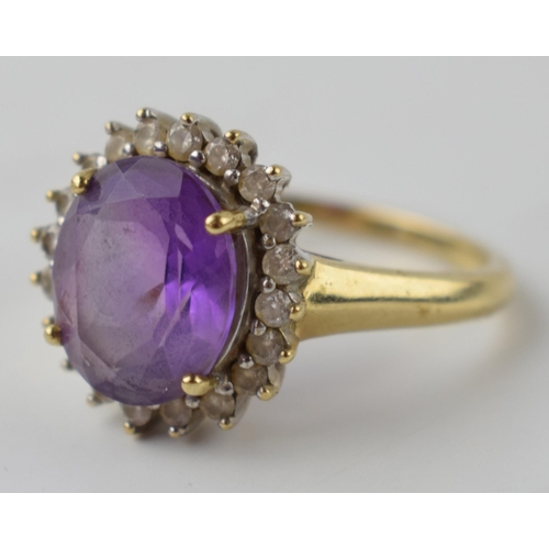 602 - 9ct gold diamond and amethyst ring, size V/W, 4.8 grams.