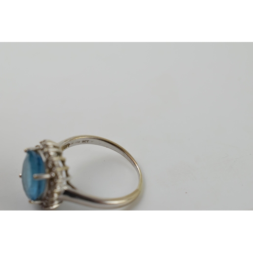 608 - 9ct gold ring with large pale blue stone with diamonds surrounding, 4.9 grams, size V.