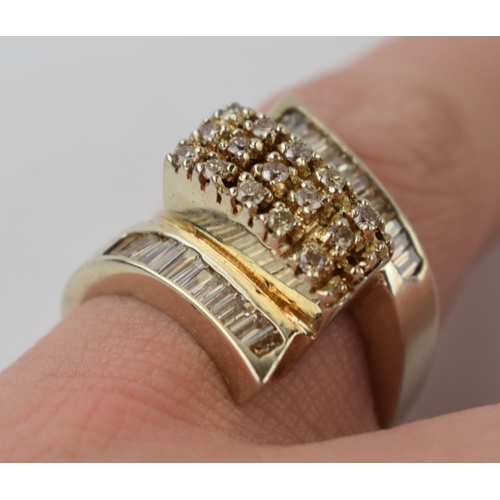 613 - 14ct gold ring set with diamonds of varying styles, 8.9 grams, size P.