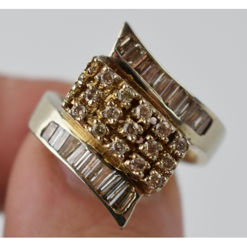 613 - 14ct gold ring set with diamonds of varying styles, 8.9 grams, size P.