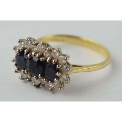 614 - 18ct gold ring set with synethetic sapphires and CZs, 3.6 grams, size L/M.