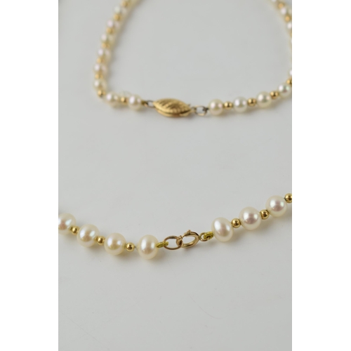 615 - A pearl necklace, set on a 9ct gold clasp, length 40.5cm, with a similar bracelet, length 19.5cm (2)... 