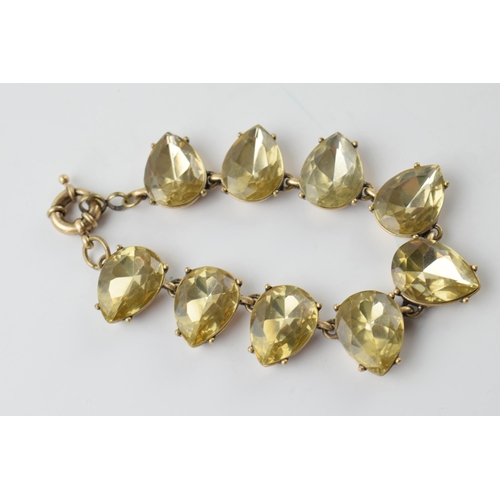 627 - Yellow metal and yellow stone in teardrop shape, chunky bracelet, 20.5cm long.