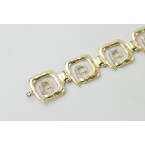 631 - Sterling silver gilt designer bracelet with matching earrings, 32.9 grams, in the style of Peter Nic... 