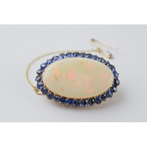 636 - Edwardian 14ct gold opal and sapphire brooch, 33x19mm opal with circa 6ct of sapphires, 40mm wide, w... 