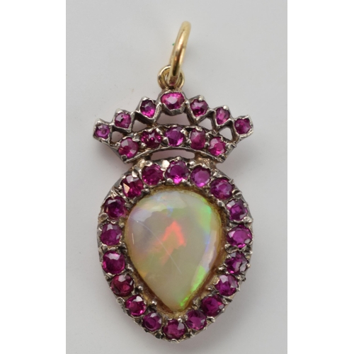 637 - Victorian pendant set with ruby and black pear cut opal, 9ct gold and silver, 25mm tall, 1.7 grams.