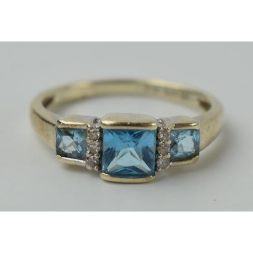 644 - 9ct gold ring set with diamonds and topaz, 2.2 grams, size N.