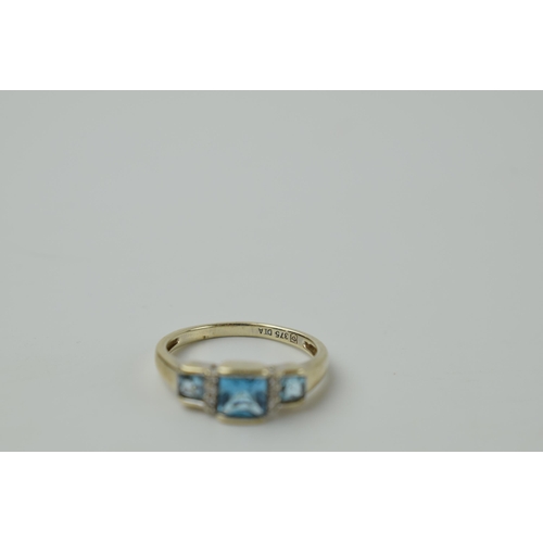 644 - 9ct gold ring set with diamonds and topaz, 2.2 grams, size N.