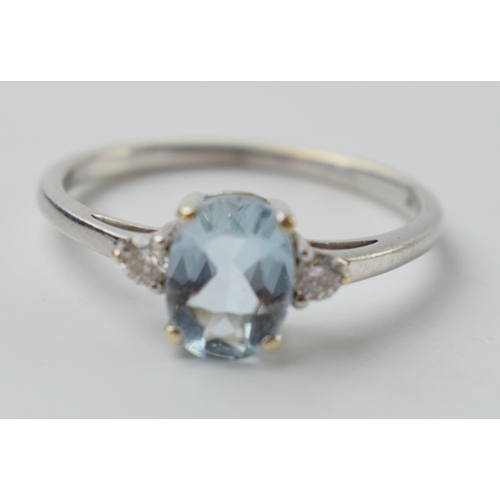 645 - 9ct white gold ring set with aqua marine and diamonds, 2.1 grams, size R.