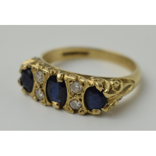 654 - 9ct gold ring set with 4 diamonds and 3 larger sapphires, 3.6 grams, size P.