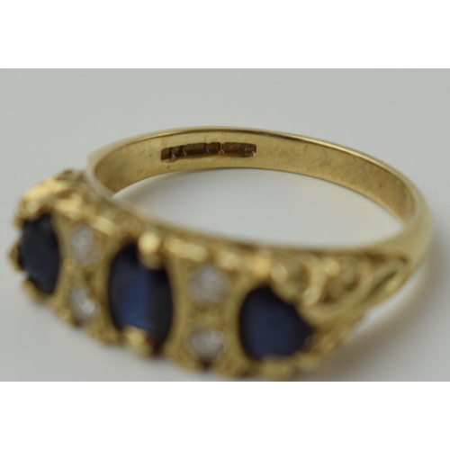 654 - 9ct gold ring set with 4 diamonds and 3 larger sapphires, 3.6 grams, size P.