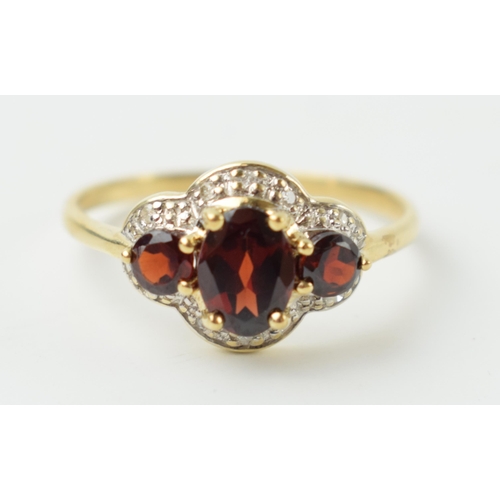 656 - 9ct gold garnet and diamond ring, 1.9 grams, size S.