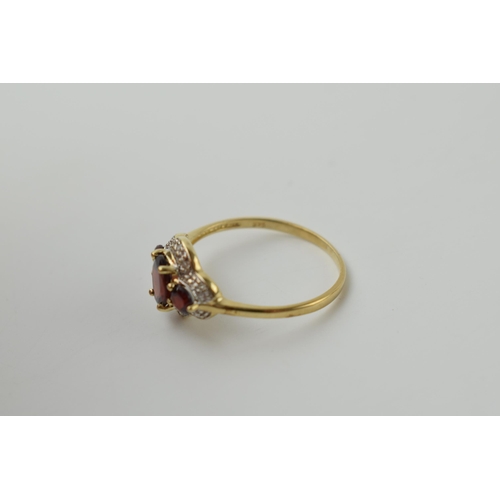 656 - 9ct gold garnet and diamond ring, 1.9 grams, size S.