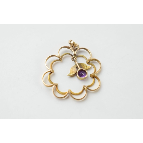 660 - Edwardian 9ct gold scroll framed pendant set with an amethyst and seed pearls, 1.4 grams.