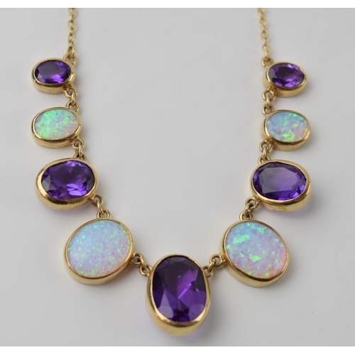 662 - 9ct gold amethyst and opal necklace set with 5 graduated amethysts and 4 graduated opals, 10.6 grams... 