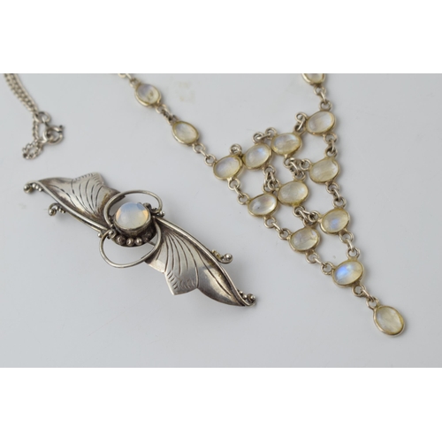 679 - Silver and moonstone necklace with matching brooch, 13.4 grams, chain 41cm long.