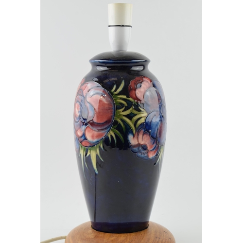 113 - Moorcroft pottery lampbase in the Clematis (or similar) floral pattern on turned wooden base, 28cm t... 