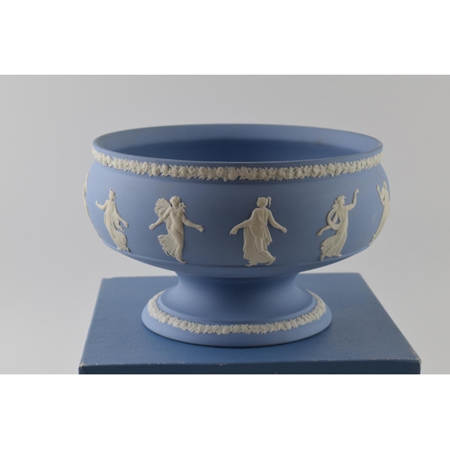 163 - Boxed Wedgwood Blue Jasperware pedestal bowl decorated with Dancing Hours relief, 23cm diameter.