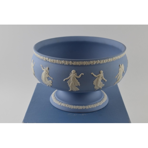 163 - Boxed Wedgwood Blue Jasperware pedestal bowl decorated with Dancing Hours relief, 23cm diameter.