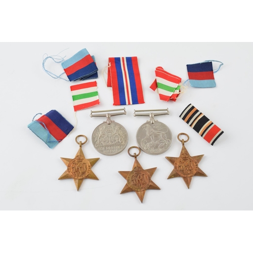 388 - A collection of WWII medals to include The 1939 - 1945 Star, Africa Star, Italy Star, Defence Medal ... 