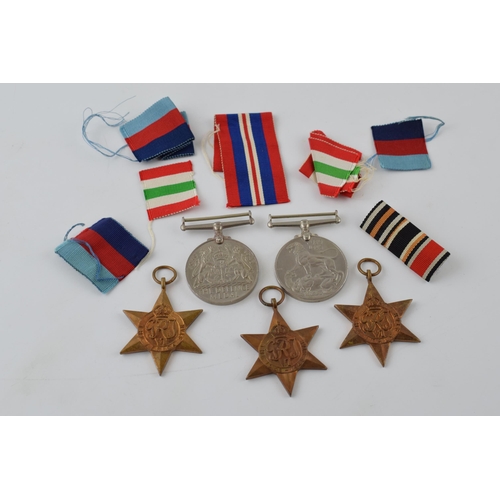 388 - A collection of WWII medals to include The 1939 - 1945 Star, Africa Star, Italy Star, Defence Medal ... 