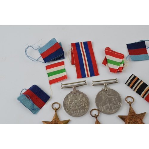 388 - A collection of WWII medals to include The 1939 - 1945 Star, Africa Star, Italy Star, Defence Medal ... 