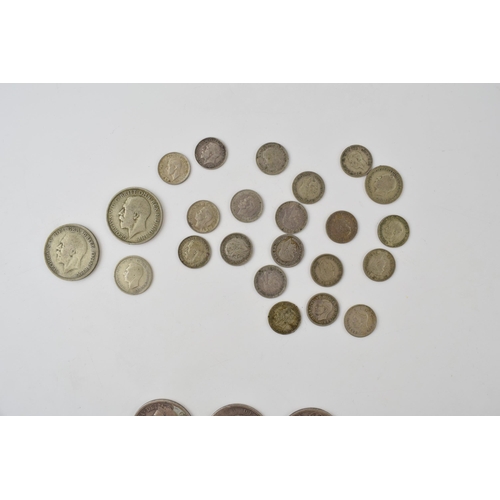 397 - A quantity of UK silver coinage. To include 54g of 1920 - 1947 coins and 55g of pre 1920 coinage. Of... 