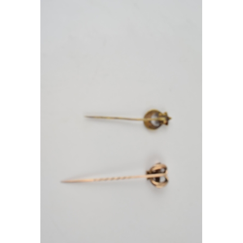 577 - 9ct gold stick pin (2.1g) together with another brass example.