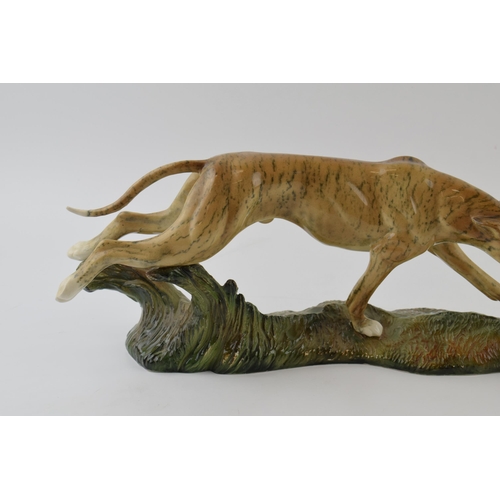 41 - Elite Pottery hunting scene tableau in the form of lurcher chasing hare, length 48cm.