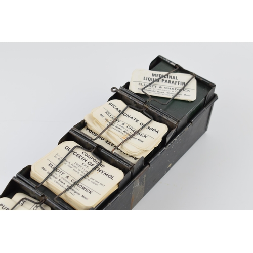 297 - 'The Alchemist Label Rack' with 6 sections for holding paper bottle labels, 43.5cm long, with some o... 