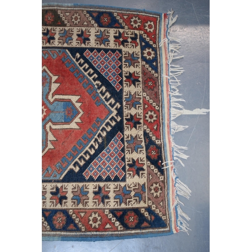 185A - Vintage Turkish hand-knotted carpet with traditional pattern in reds, blues, creams and browns, 109x... 