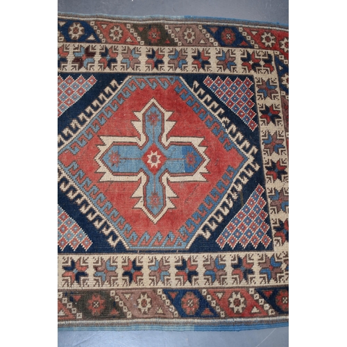 185A - Vintage Turkish hand-knotted carpet with traditional pattern in reds, blues, creams and browns, 109x... 