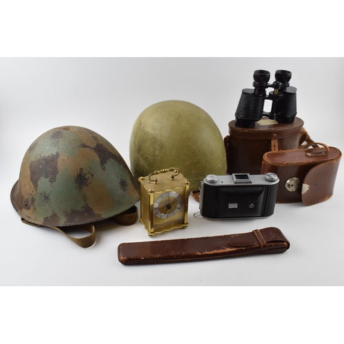 207 - A mixed collection of items to include military helmet, vintage motorcycle helmet, camera and binocu... 