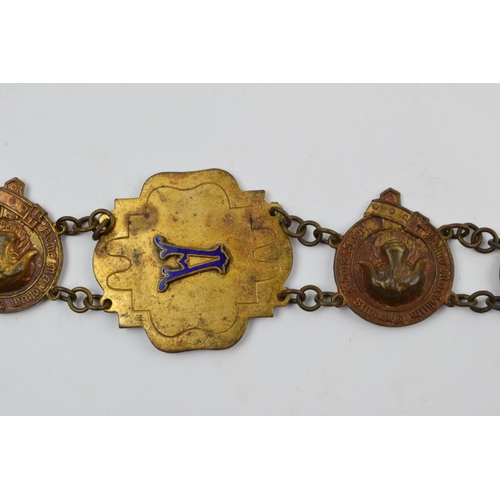 302 - Masonic Interest: a Masonic regalia / chain collar with a quantity of enamel, gilt metal and metal b... 