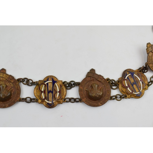 302 - Masonic Interest: a Masonic regalia / chain collar with a quantity of enamel, gilt metal and metal b... 