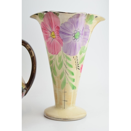 21 - A pair of Arthur Woods floral shaped trumpet vases and a large two handled floral vase, believed to ... 