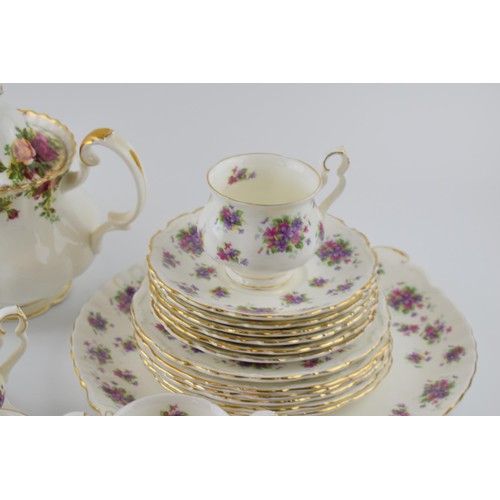 166 - Royal Albert tea ware to include an Old Country Roses teapot with a set of 6 trios in the Violetta p... 