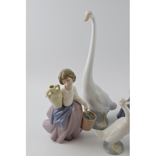 103 - Nao by Lladro to include girl sitting with straw hat, a girl with a puppy, girl with a bird and a gi... 