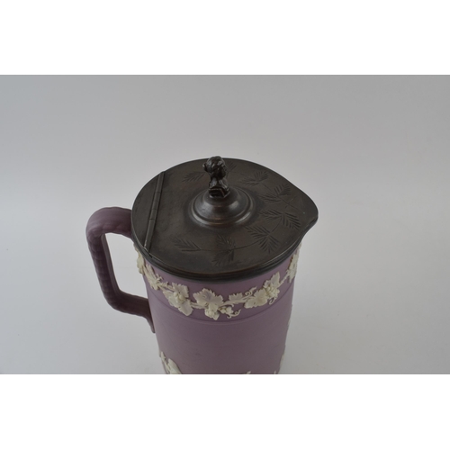 105 - Wedgwood lilac dipped Jasperware. Upright rope handle jug with hinged pewter lid. Height 22cm.