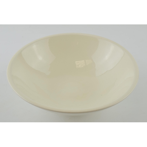 196 - Norman Wilson for Wedgwood: a cream ware pedestal bowl of modernist form, 23cm diameter, impressed N... 