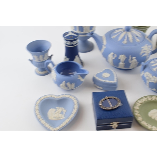 199 - Wedgwood Jasperware to include a blue teapot, a boxed silver brooch, vases and others with 2 non Wed... 