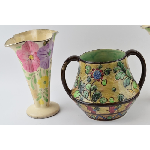 21 - A pair of Arthur Woods floral shaped trumpet vases and a large two handled floral vase, believed to ... 